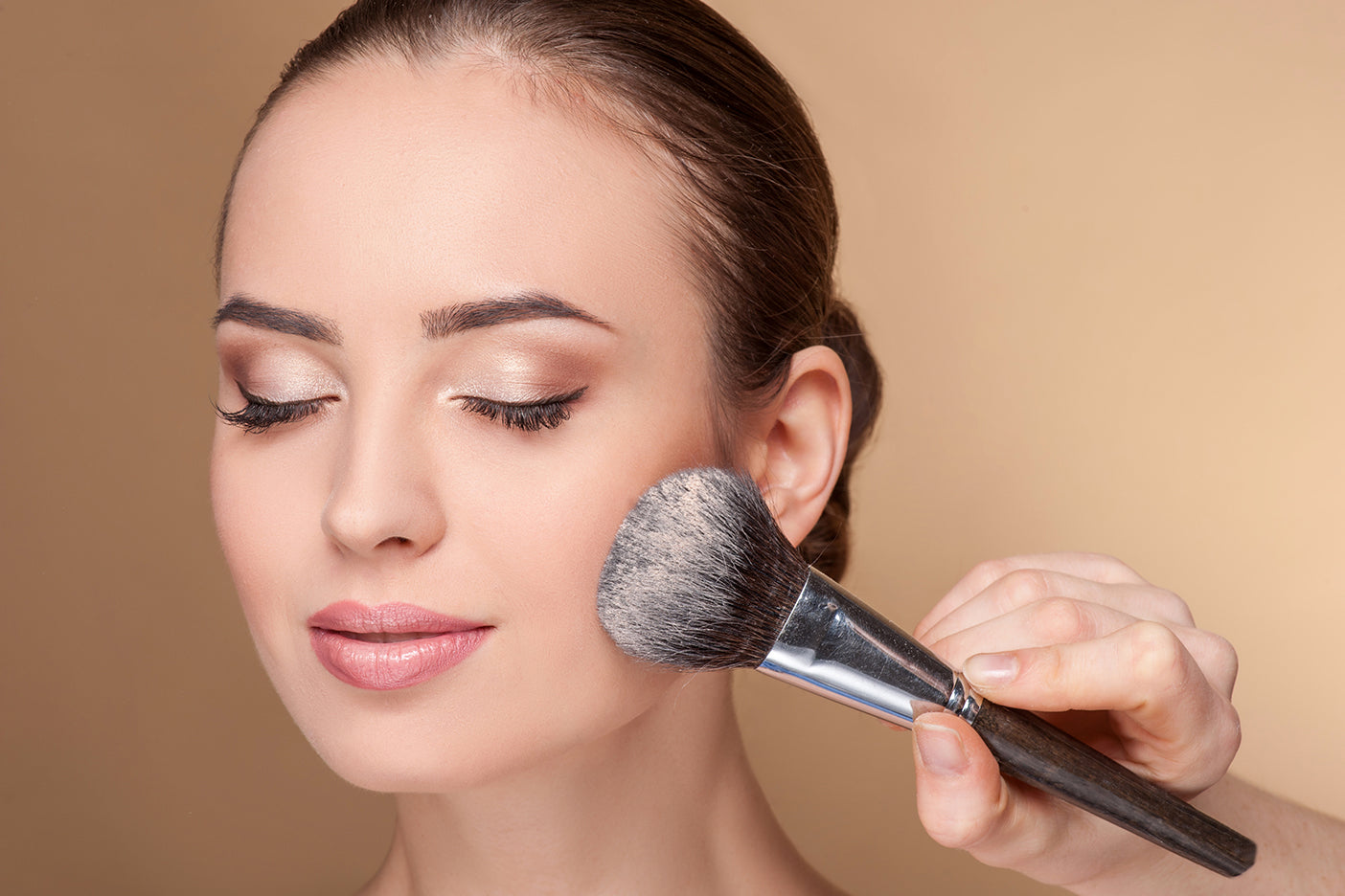 Model applying makeup