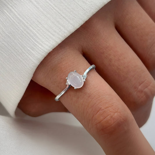 Close-up of a hand wearing a ring with a quarts and two diamonds in the side