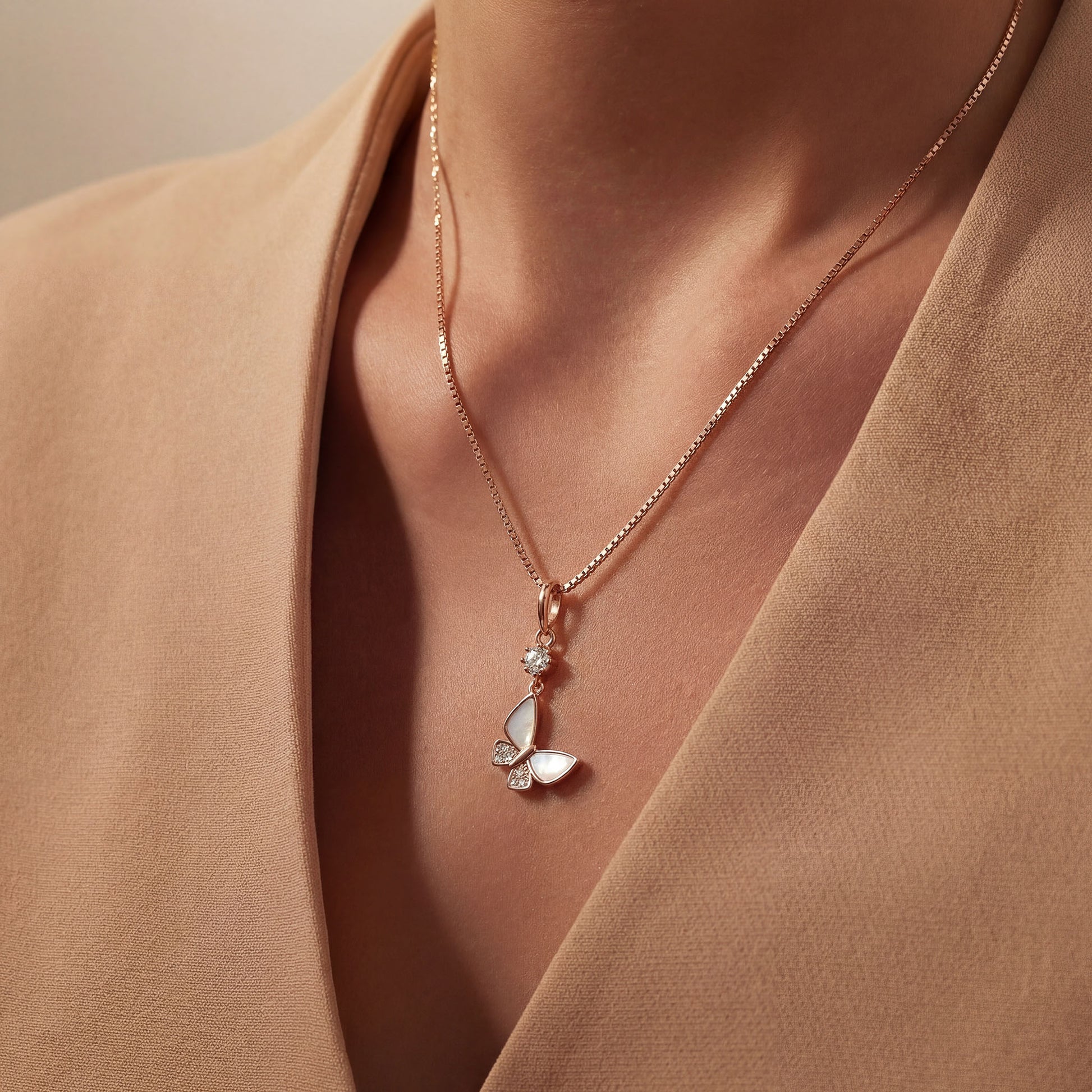 925 Silver butterfly charm on a persons neck, worn with a chain