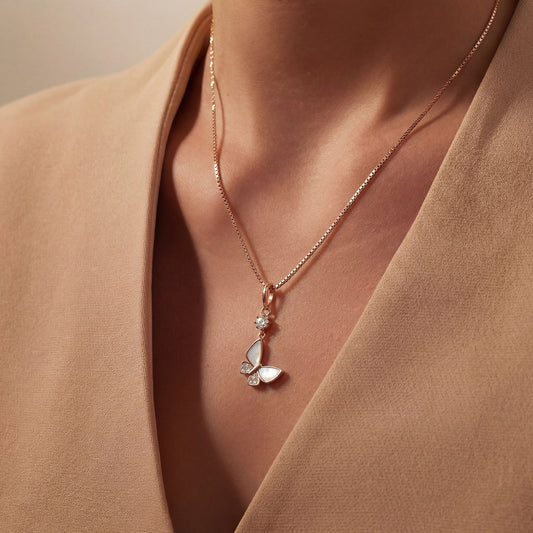 925 Silver butterfly charm on a persons neck, worn with a chain