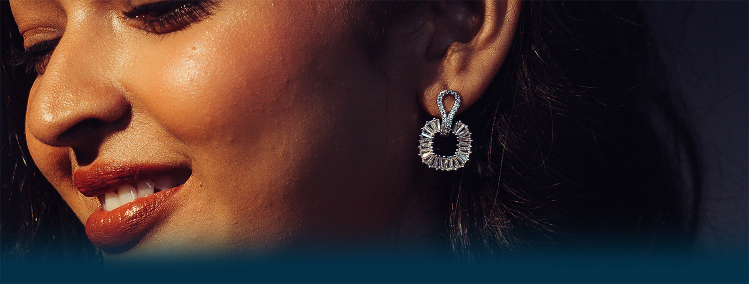 Close-up of a woman wearing a silver earring