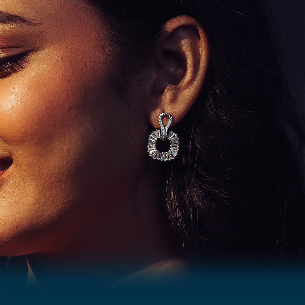 Close-up of a woman wearing a silver earring
