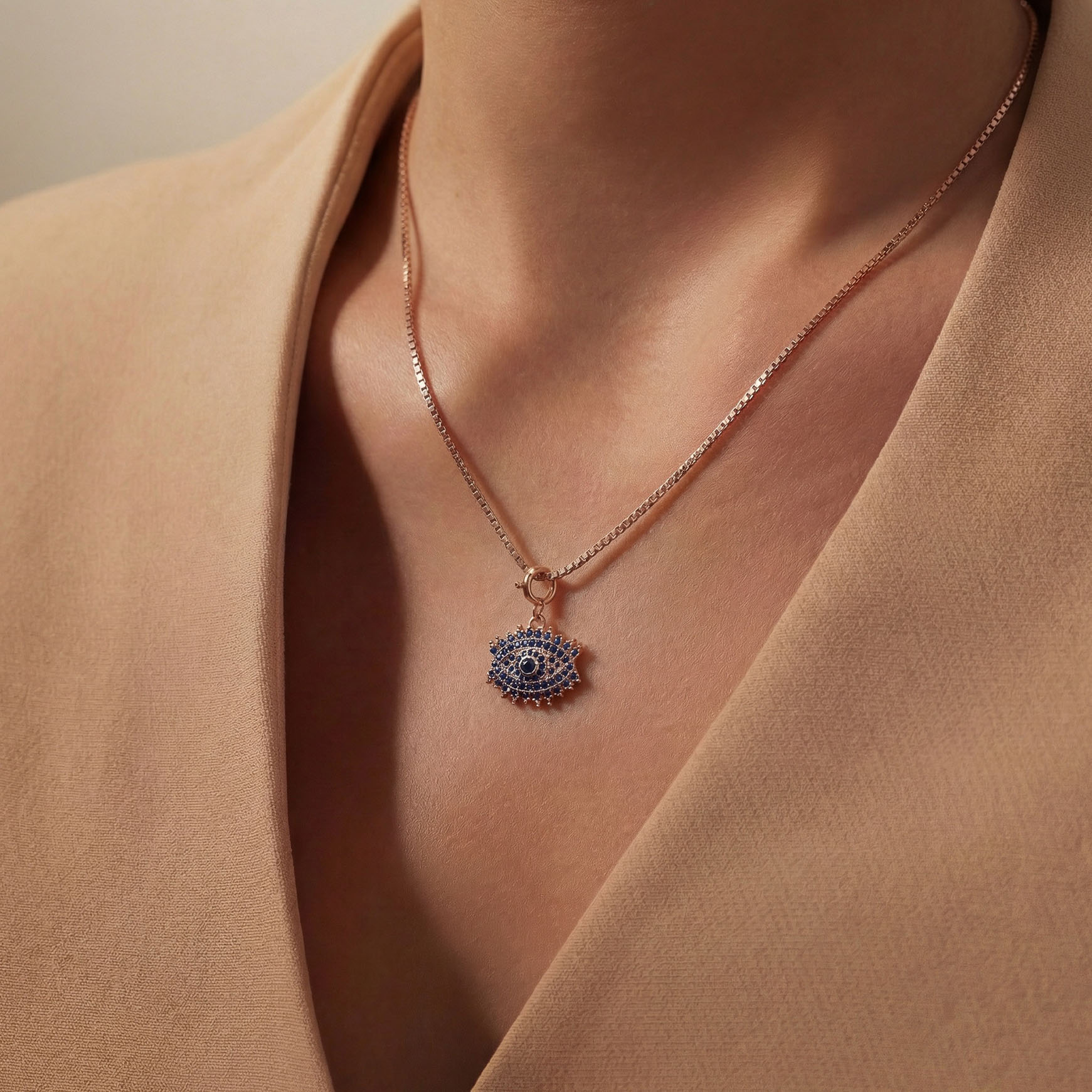 Evil eye charm as a pendant on a girls neck