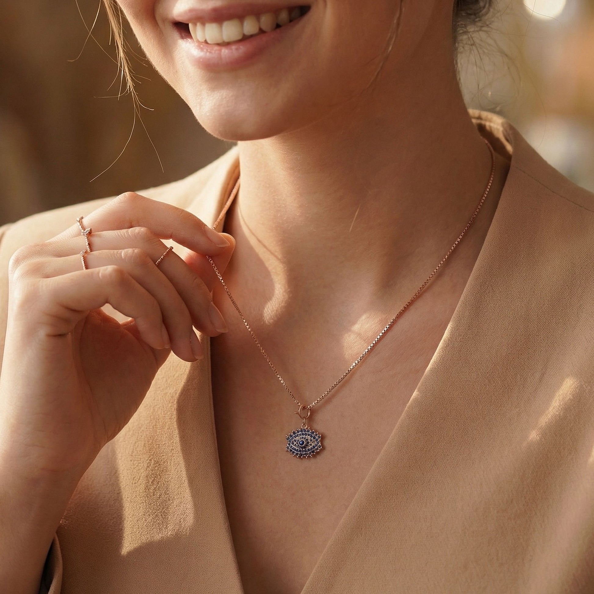 Evil eye charm with chain on neck