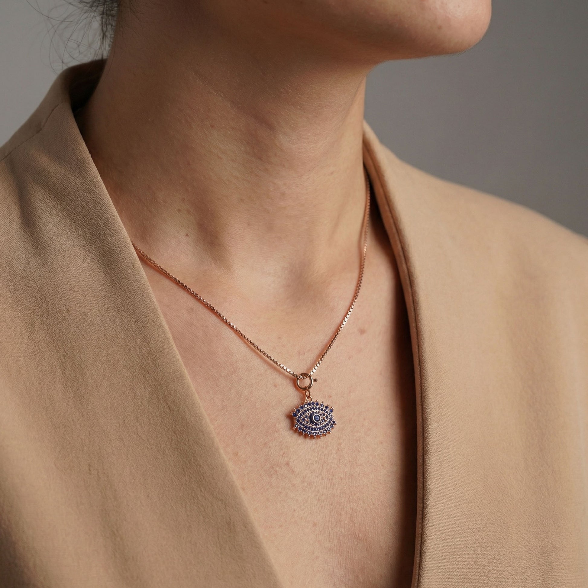 Evil eye charm with chain on neck