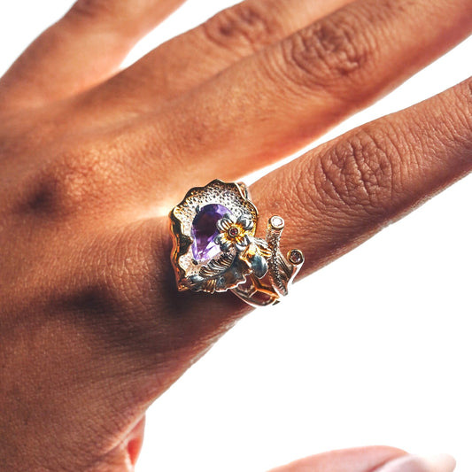 Garden whisper ring with amethyst stone and a beautiful garden like pattern with branches and flower in gold and silver finish