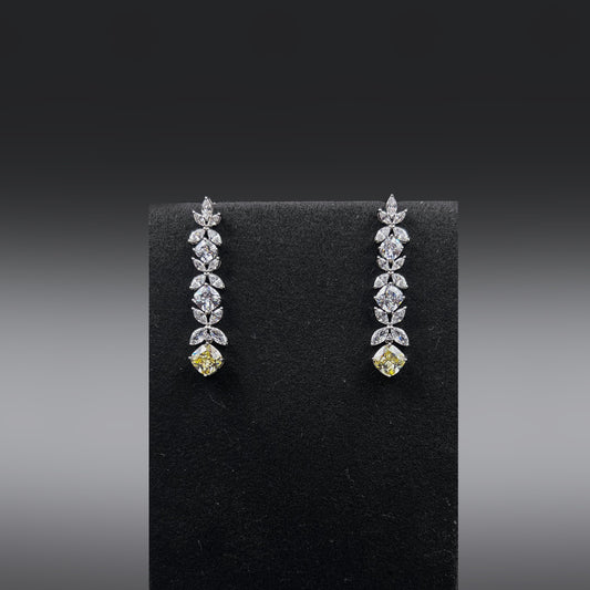 Pair of earrings with high quality white zircon stones and a yellow stone at the bottom