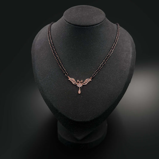 Guardian Mangalsutra with an angelic pendant on a black mannequin