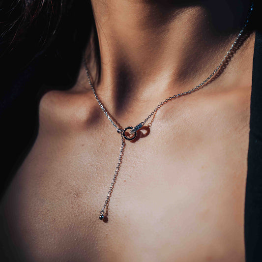 Sterling silver two solid circles intertwined with drop chain 