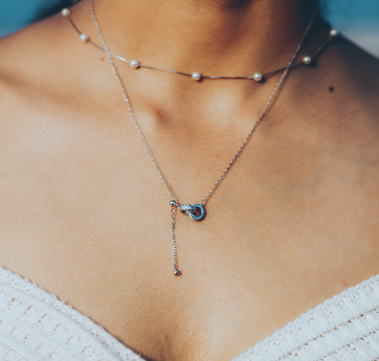 Intertwined circles pendant on a model