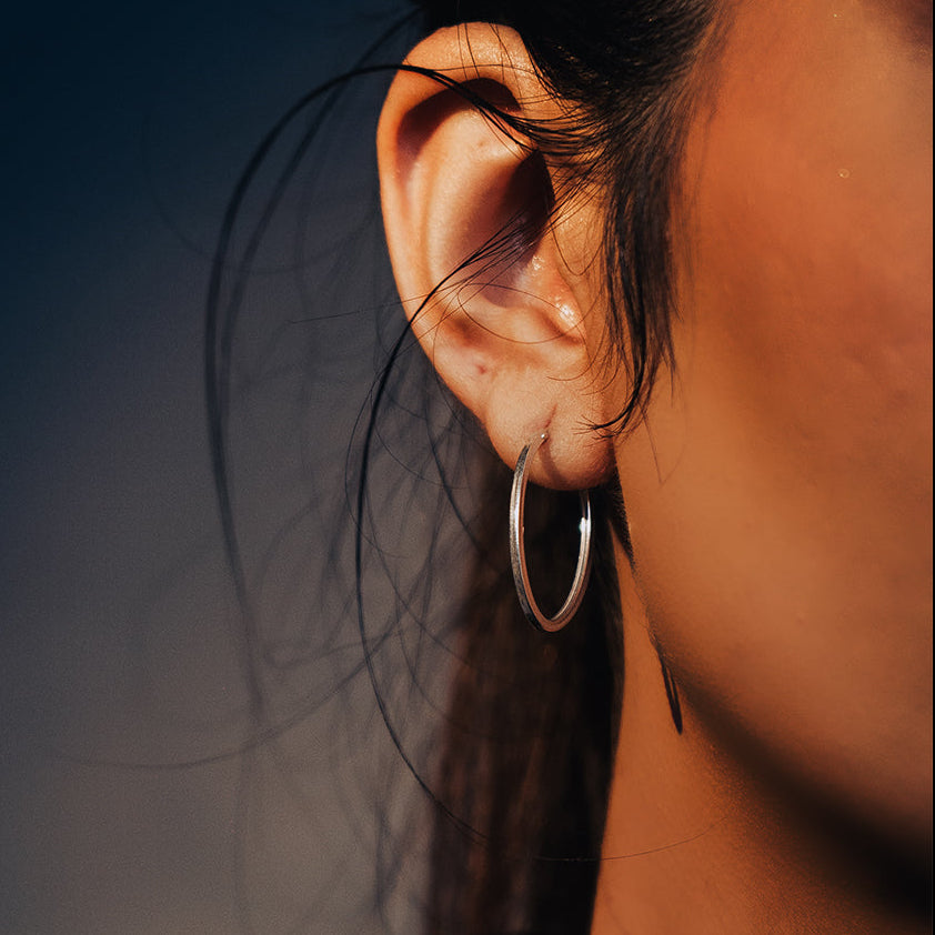 Sterling silver oval shaped hoop earrings