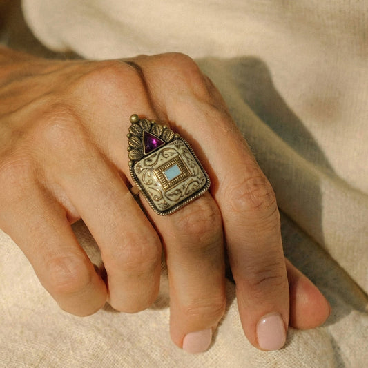 Elfy 925 Sterling Silver Antique Tribal Ring featuring a handcrafted square motif with intricate scrollwork, a central turquoise colored inlay, and a triangular pink gemstone crown. A bold vintage style statement ring for boho fashion