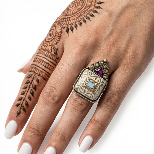 Elfy 925 Sterling Silver Antique Tribal Ring featuring a handcrafted square motif with intricate scrollwork, a central turquoise colored inlay, and a triangular pink gemstone crown. A bold vintage style statement ring for boho fashion