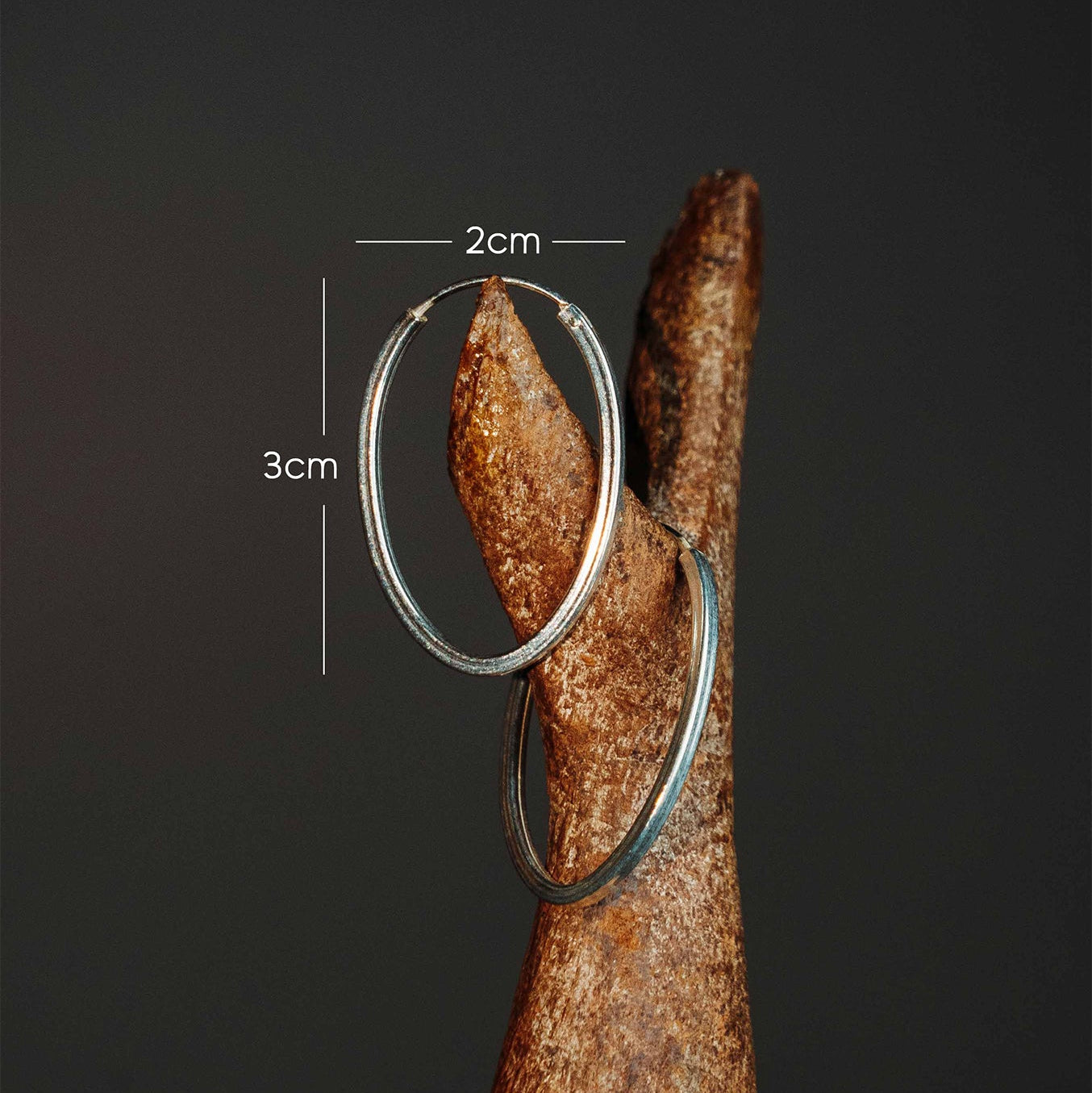 Sterling silver oval shape hoop earrings dimensions. they are 3cm long and 2 cm wide