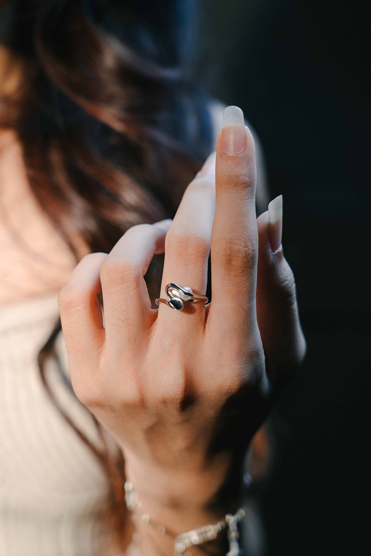 Sterling silver pearl ring on a model