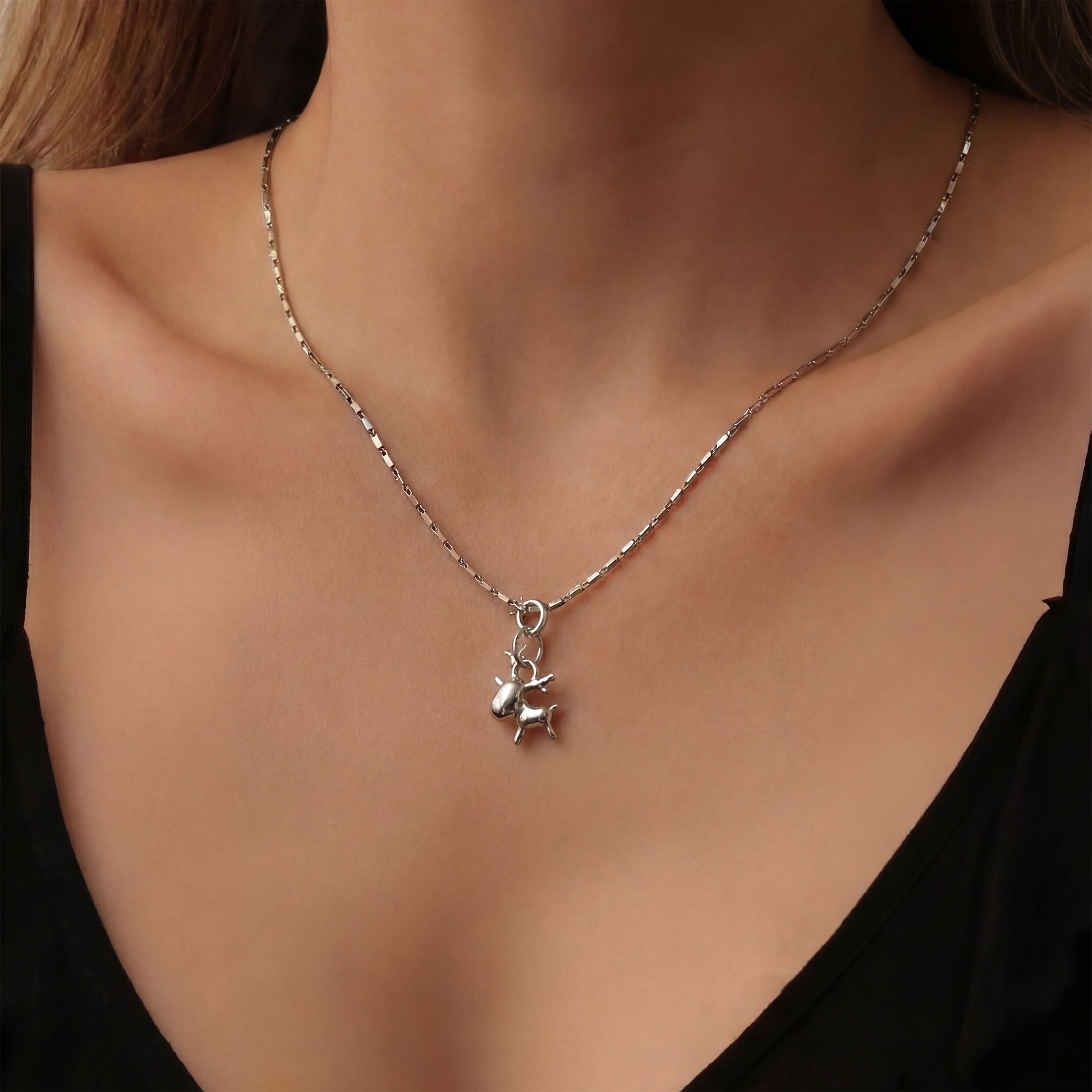 Pure silver reindeer charm, worn with a chain