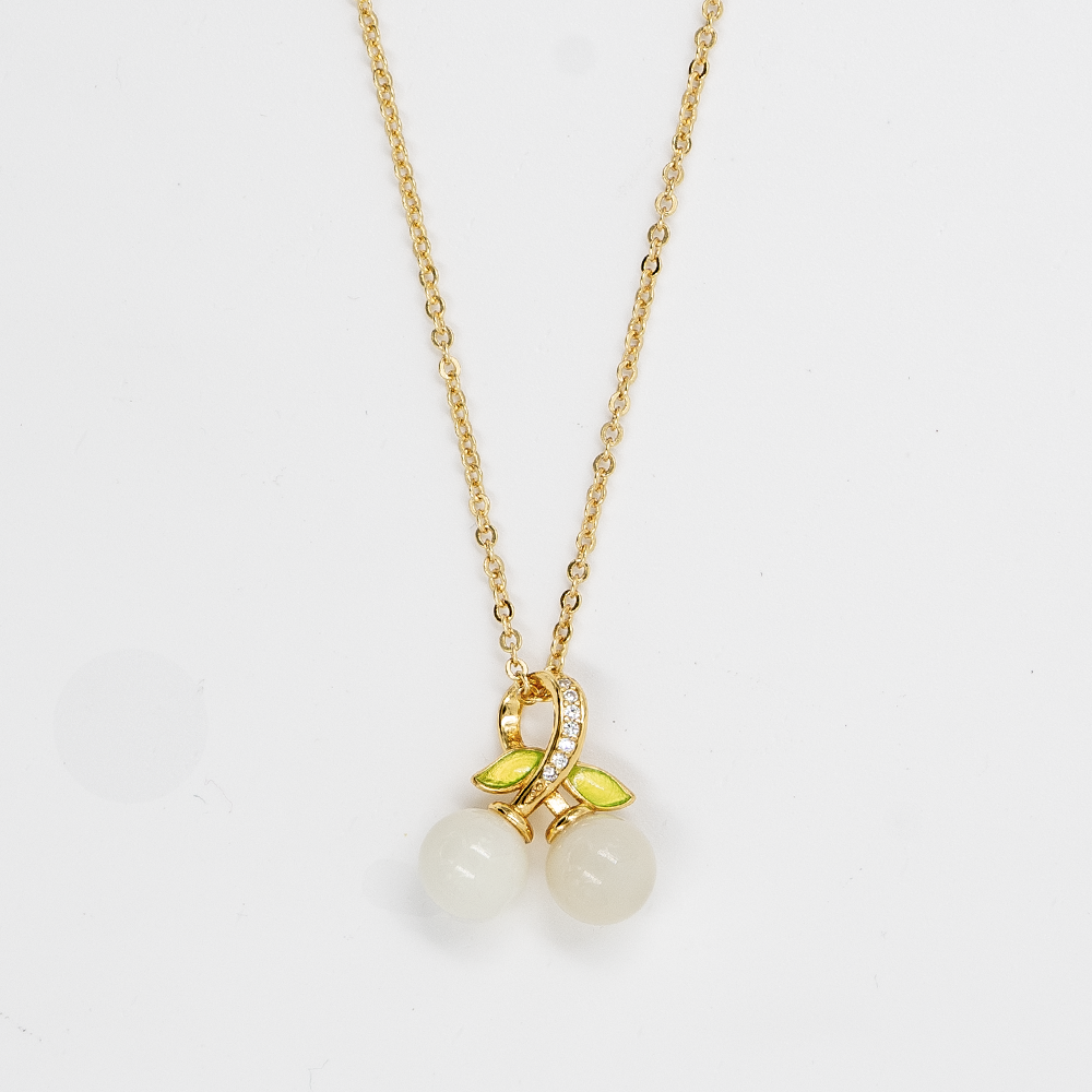 Elfy 925 Sterling Silver gold-plated necklace featuring a whimsical cherry pendant with two white round stones and vibrant green leaves on a white background—A chic and unique nature-inspired jewelry gift for her in 2026.