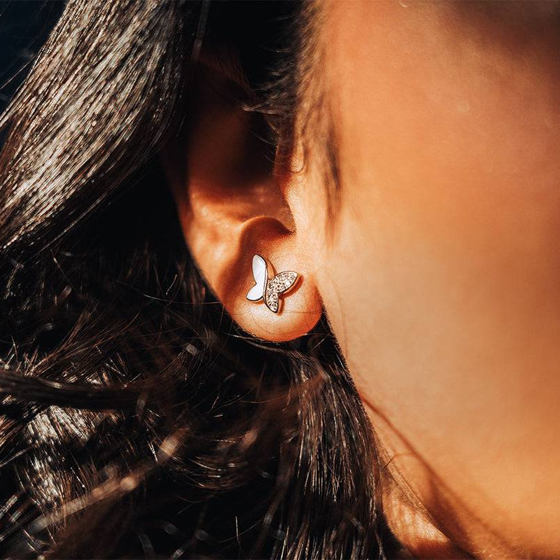 Sterling silver studs in the shape of butterfly with white enamel