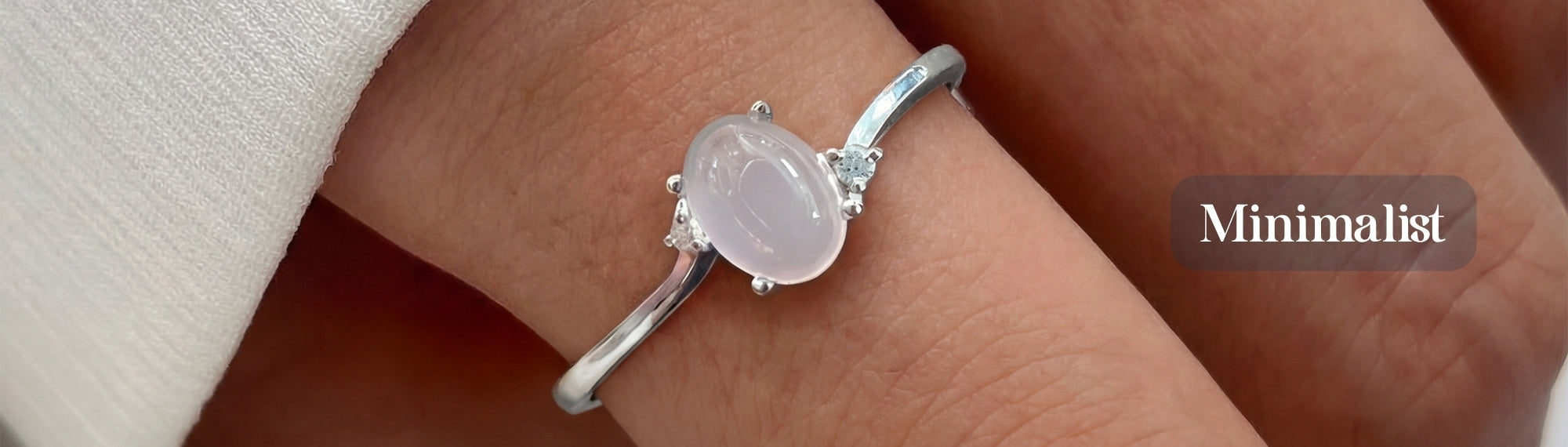 Discover a sterling silver opal ring with a delicate oval gemstone.