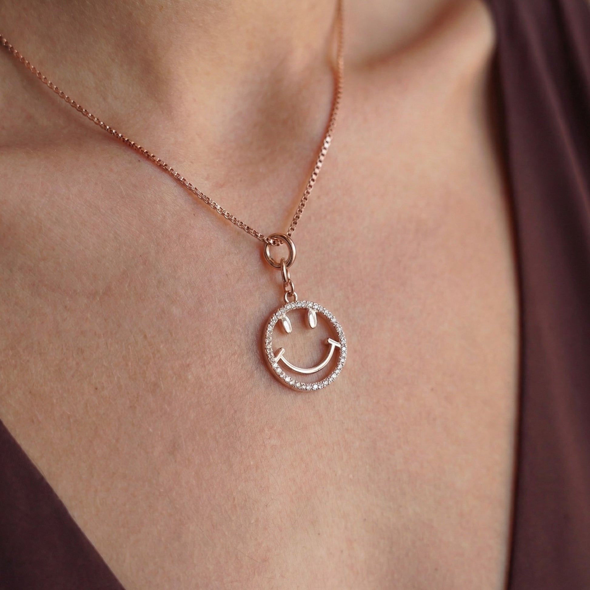 Rose gold smiley charm with a chain