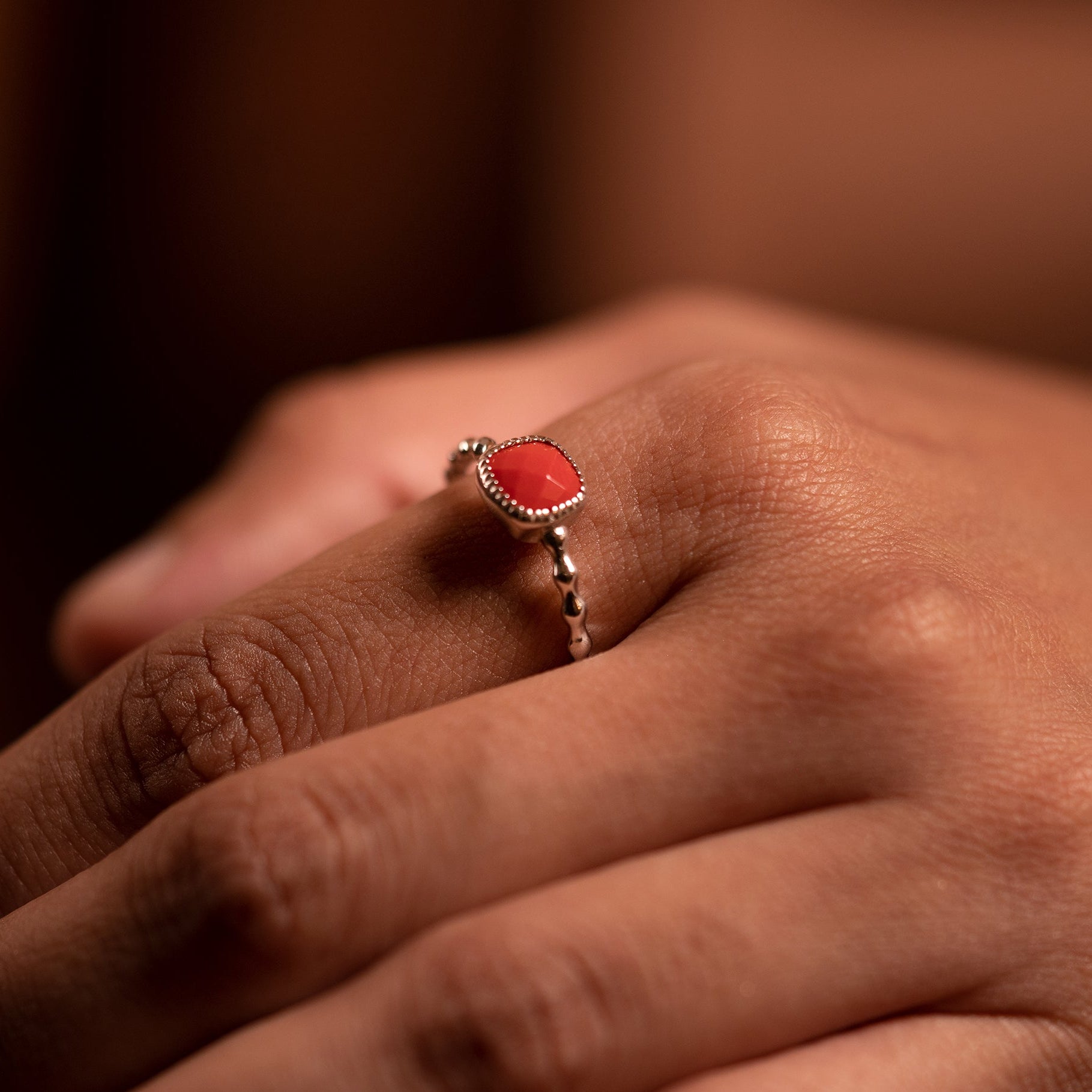 Crimson drop ring with designed ring band and red stone at the top making it perfect for wedding and occasional wear