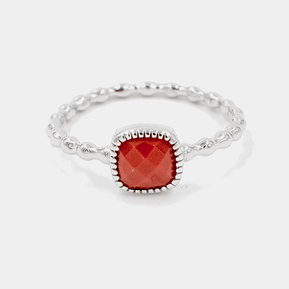 Crimson Drop Ring on white background, the design is shown beautifully and the carving on red stone on the top is shown perfectly.