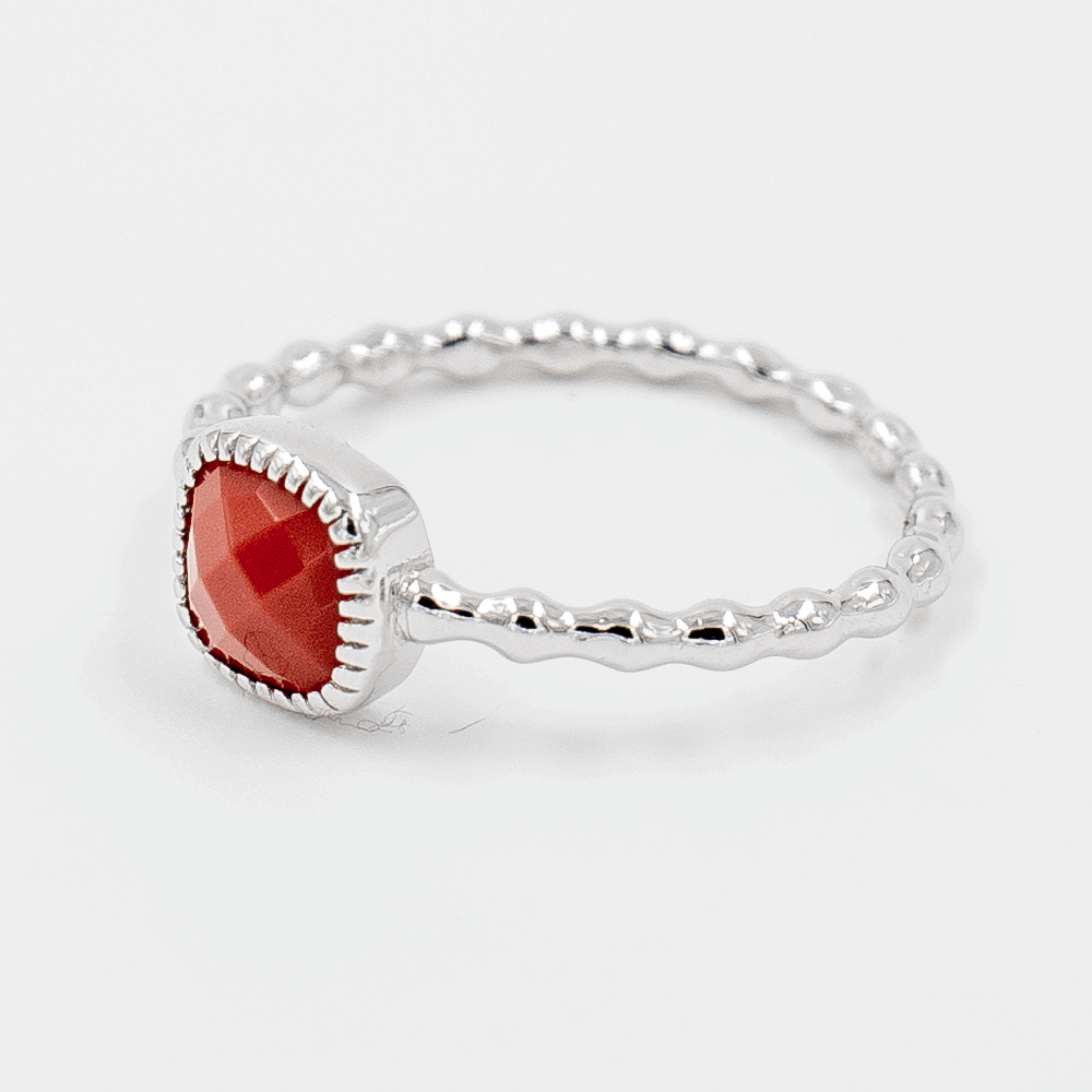 Crimson Drop Ring on side angle on white background with red stone shown beautifully