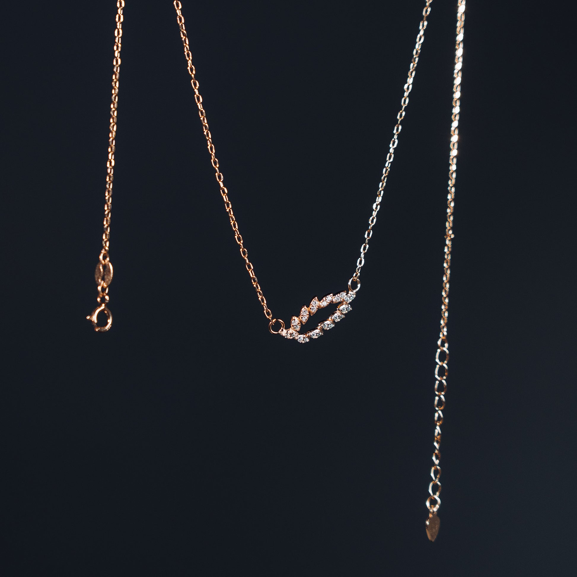 Elfy 925 Sterling Silver Rose Gold Leaf Pendant Necklace featuring a delicate open-leaf design encrusted with shimmering marquise-cut crystals, gracefully displayed against a deep black background—An elegant and nature-inspired fine jewelry gift