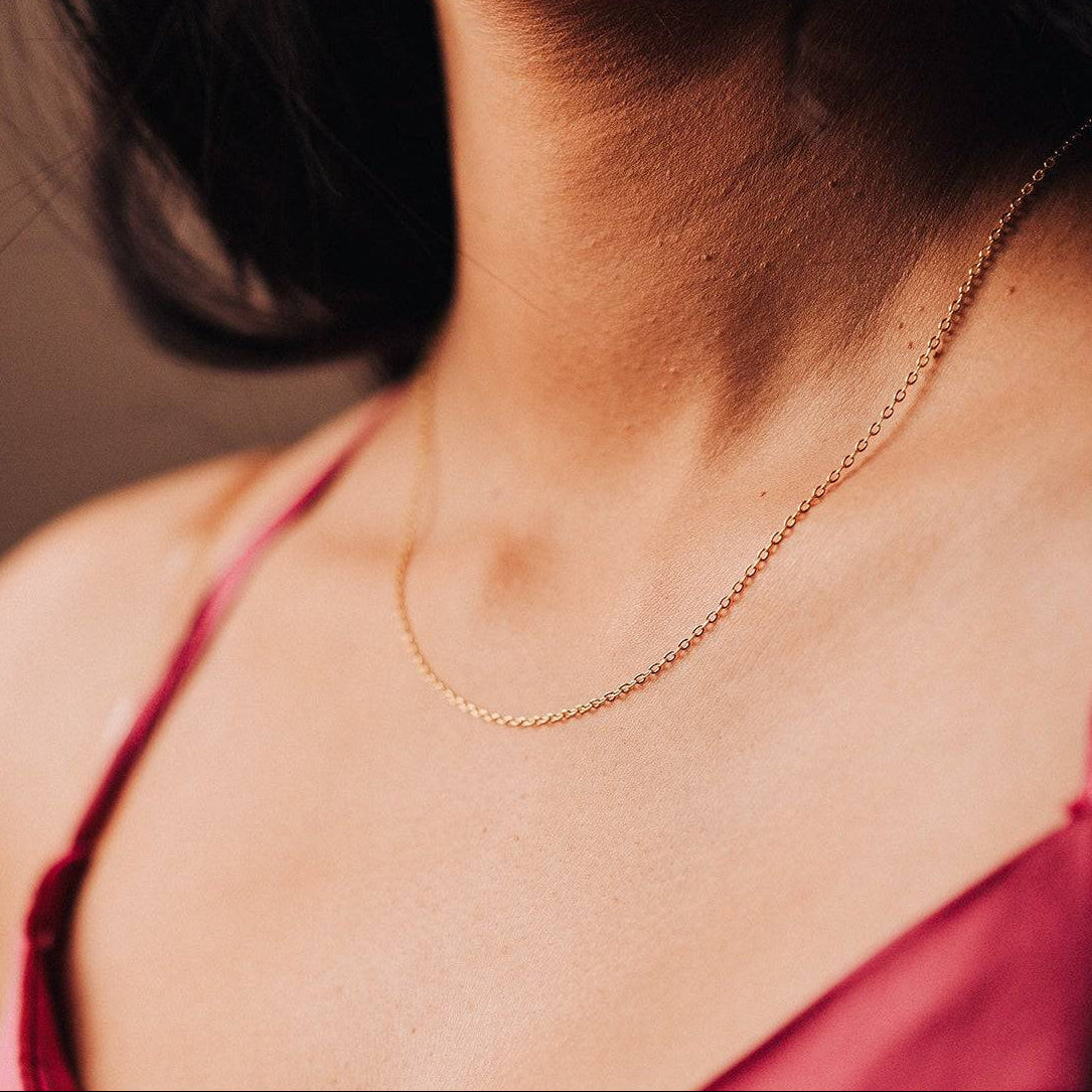 Sterling silver gold chain on that classy party dress.