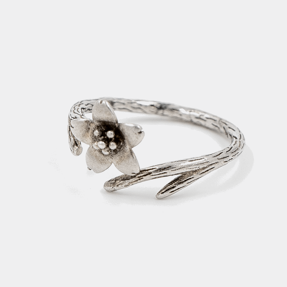 925 Silver Elfy Bloom Ring on white background. The ring is adjustable and oxidised