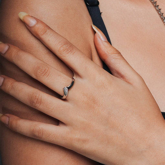 Everyday ring for that perfect everyday worn on a hand of a model which is adjustable and has a triangle design with one side zircon studded.