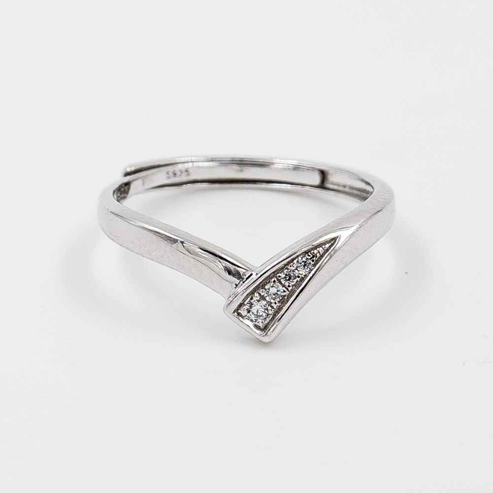 Silver ring with diamond accents on a white background. it's an adjustable ring.