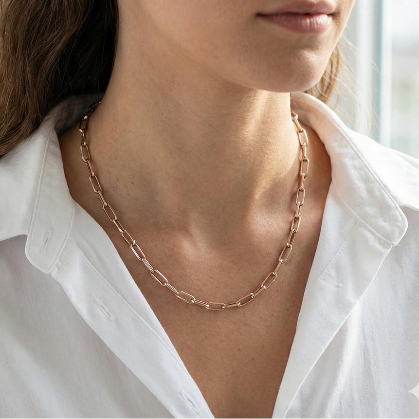 Sterling silver rose gold paperclip charm chain on models neck