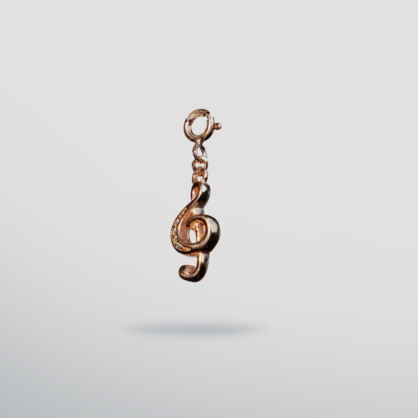 Sterling silver. rose gold music note clef charm