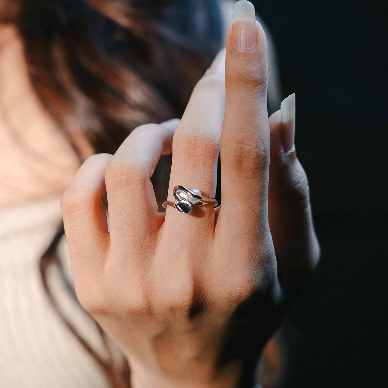 Sterling silver pearl ring on a model