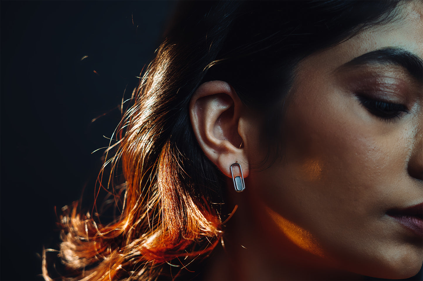 model wearing mother of pearl earrings