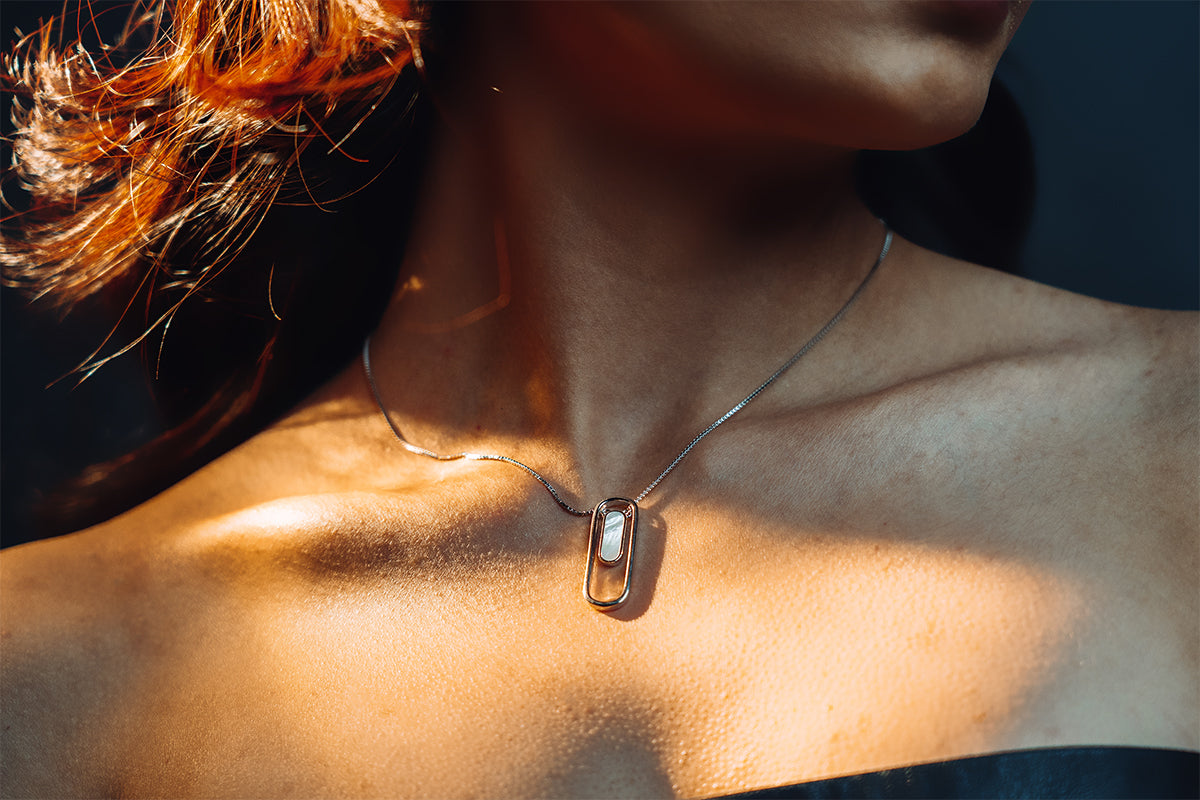 Model wearing sterling silver mother of pearl pendant