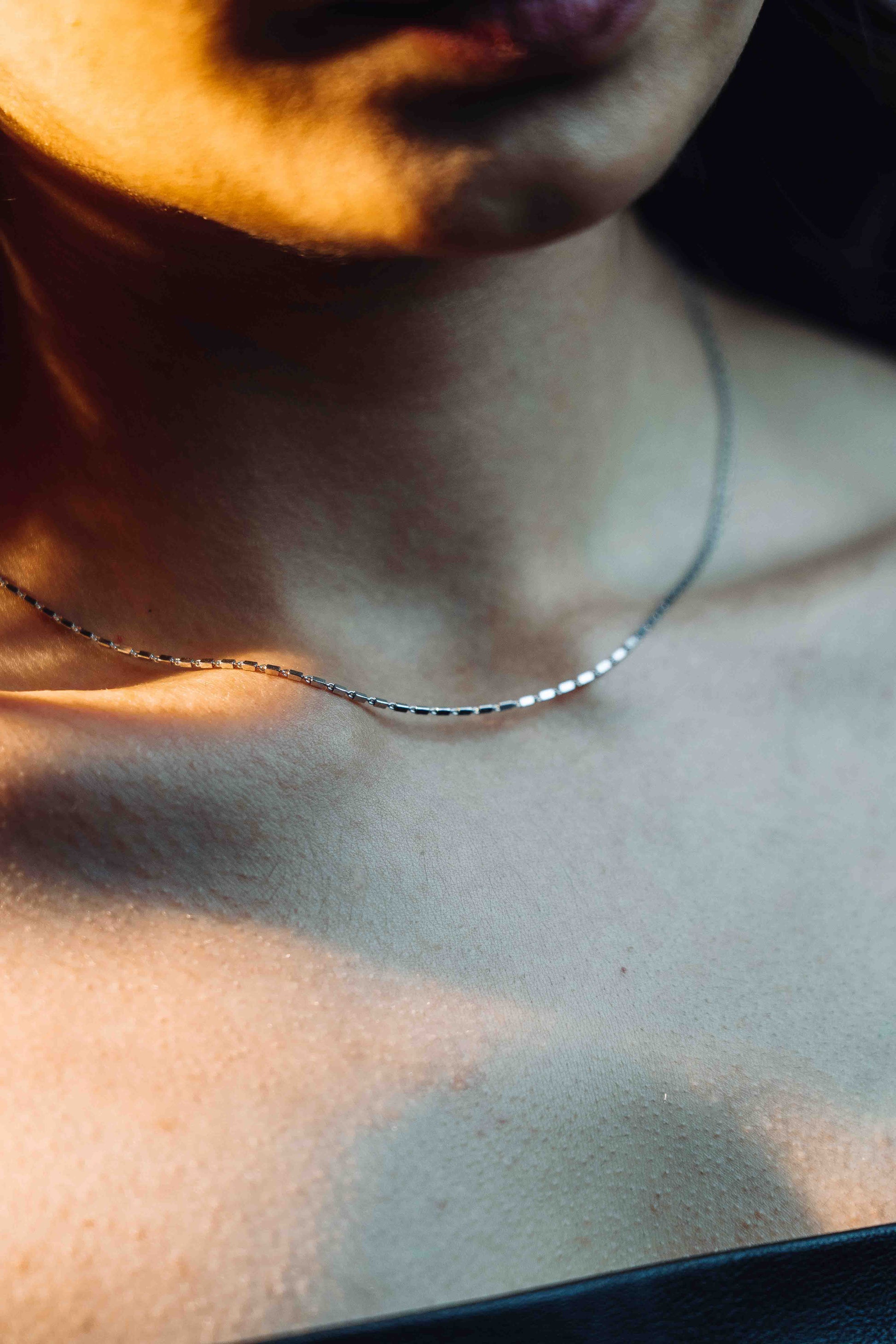 A sterling silver chain which has tiny rectangles interlocked