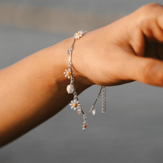 elfy bloom charm bracelet on model hand on beach