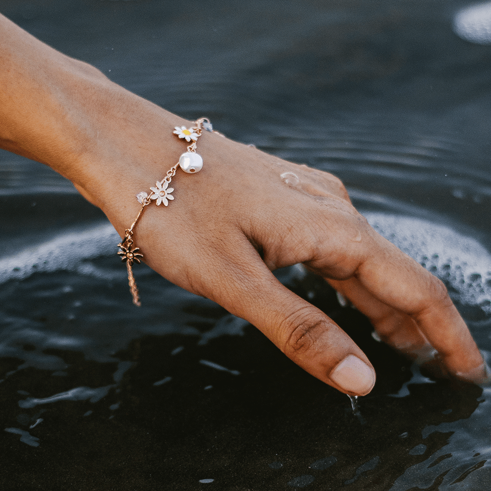 elfy bloom charm bracelet on beach water