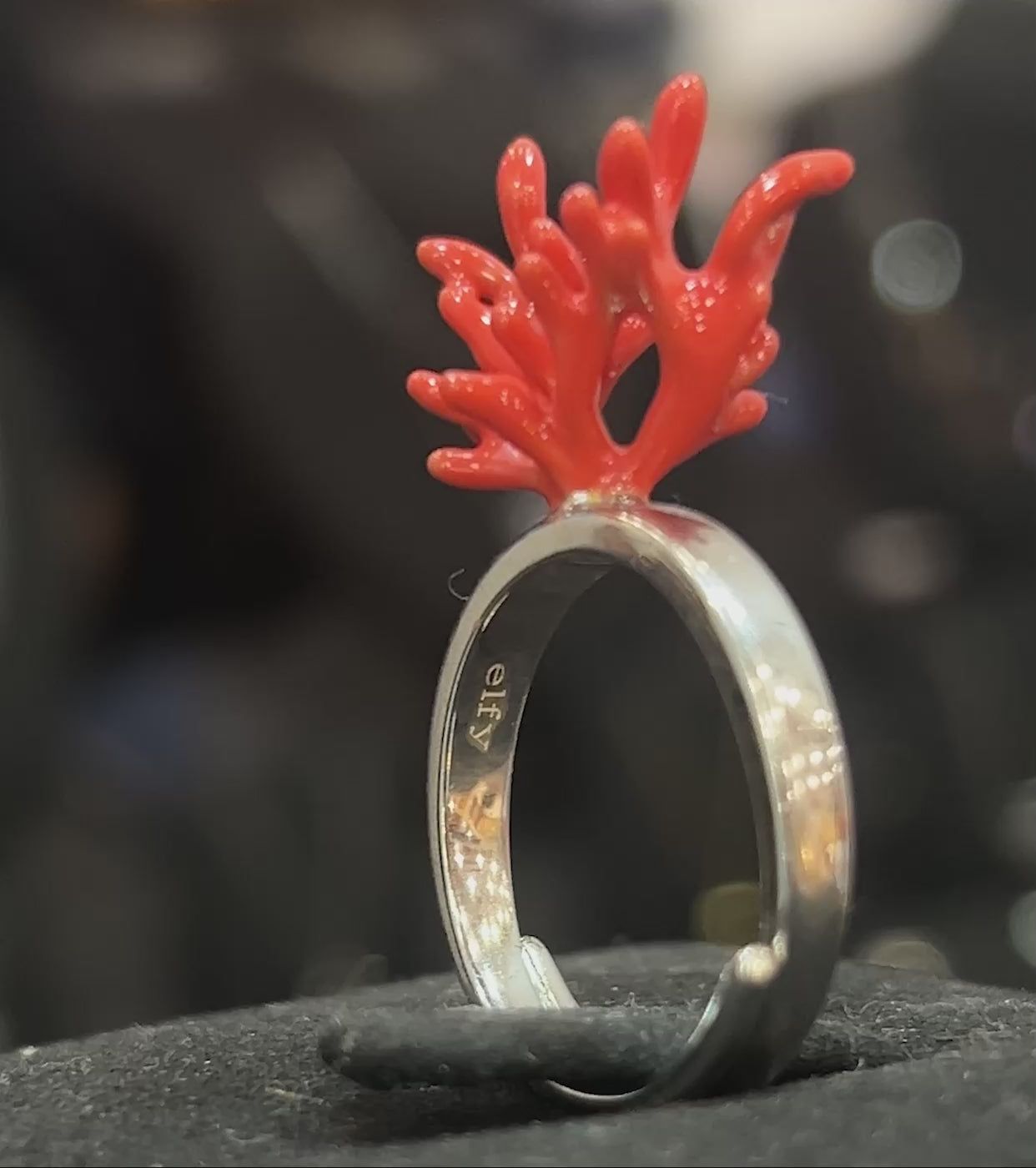 Silver ring with a red coral like design