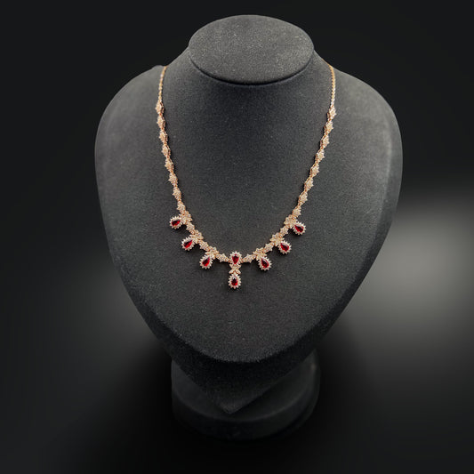 Necklace with red gemstones on a display stand